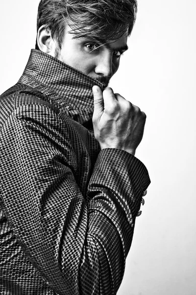 Elegant stylish handsome man. Black-white studio fashion portrait.
