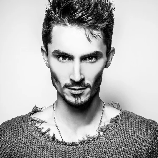 Elegant stylish handsome man. Black-white studio fashion portrait.