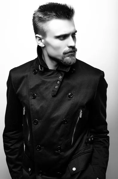Elegant stylish handsome man. Black-white studio fashion portrait.