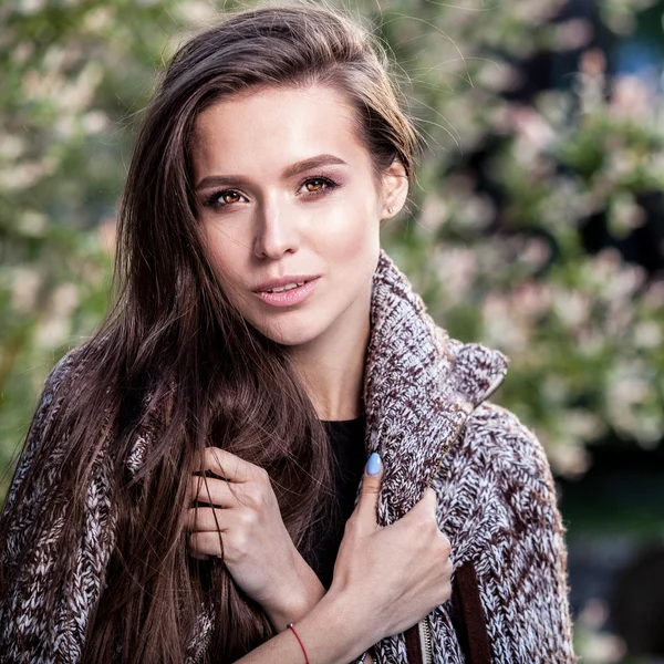 Outdoors black-white portrait of beautiful young long hair brunette woman