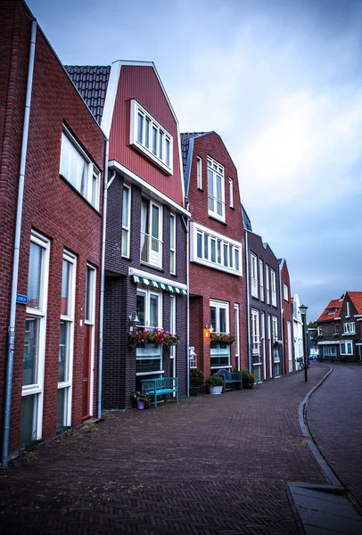 Traditional residential Dutch buildings. General landscape at twilight.