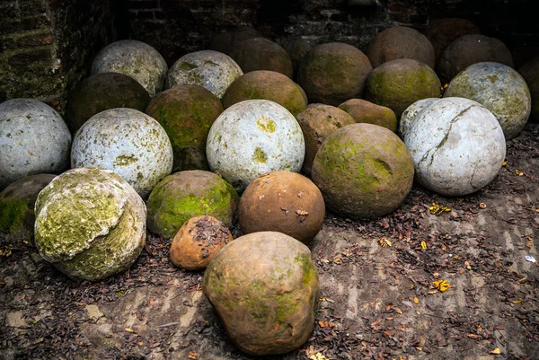 Huge spherical stones under castle