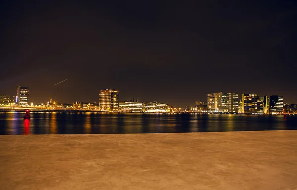 City sights of Amsterdam at night. General views of city landscape.