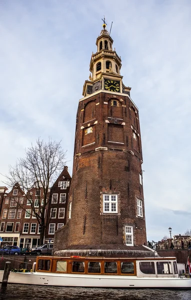 AMSTERDAM, NETHERLANDS - JANUARY 30, 2015: Beautiful views of streets, ancient buildings, boat, embankments of Amsterdam - also call \