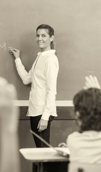 Happy teacher with multi ethnic classroom at school