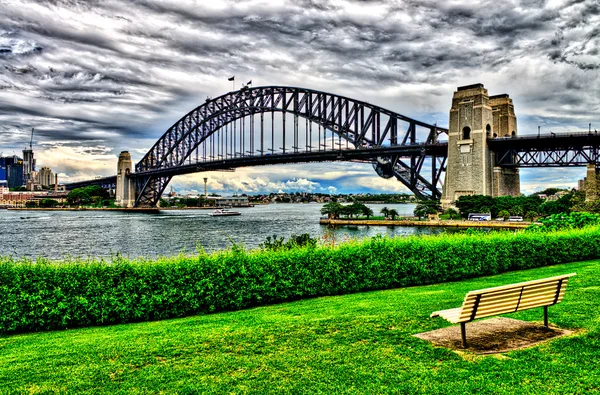 Sydney Harbour Bridge framed by vegetation - New South Wales - A