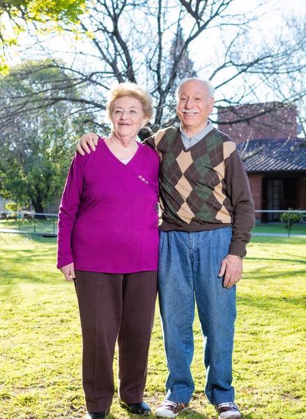 Happy senior couple relaxing outdoor on a sunny day