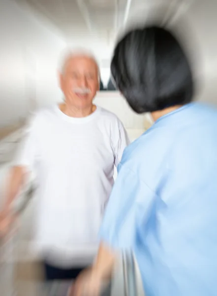 Elder people making exercises in a rehab clinic for ritired