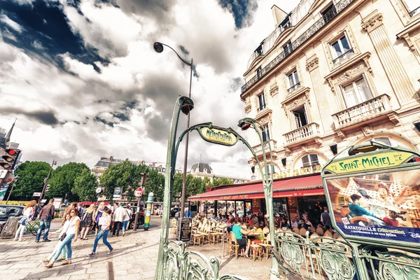 Tourists walk in Quartier Latin. Paris