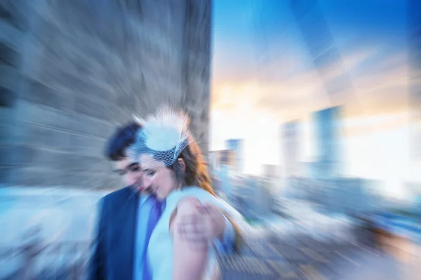 Zoomed and blurred picture of newlyweds on Brooklyn Bridge