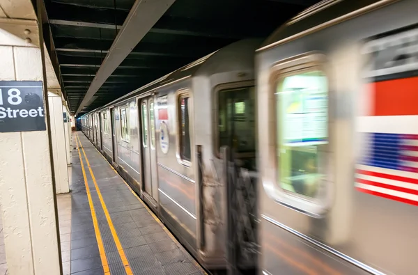 Fast moving train in New York subway. 18th street station