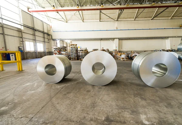 Cold rolled steel coils in storage area ready to feed to machine