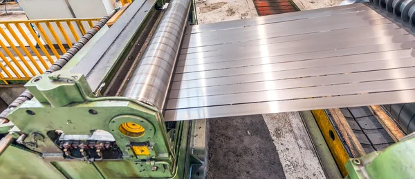 Steel coil cut machine. Industrial environment