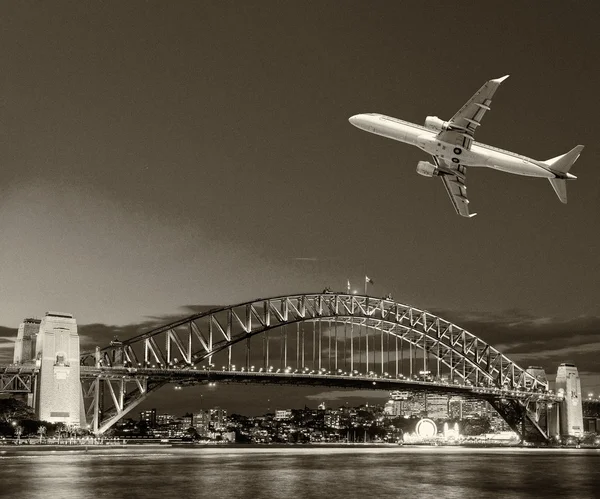 Black and white view of airplane over Sydney. Tourism concept