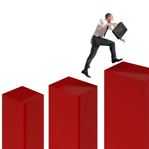 Businessman runs and jumps on statistic