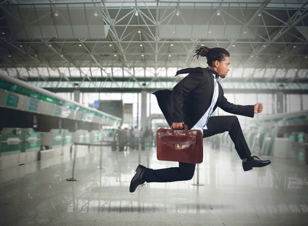 Businessman runs in the airport