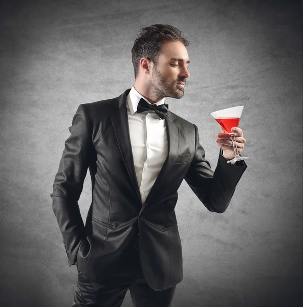 Businessman drinking his cocktail