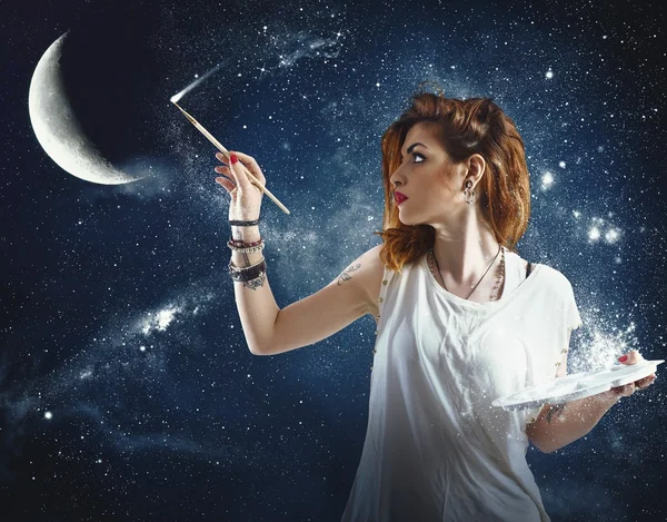 Girl paints the moon