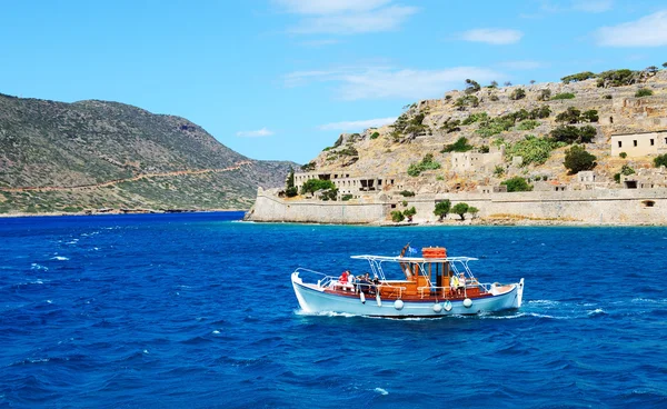 SPINALONGA, GREECE - MAY 14: The motor yacht with tourists is ne