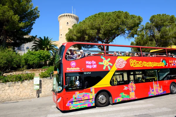 MALLORCA, SPAIN - MAY 30: The tourists enjoiying their vacation on the city sight seeing bus on May 30, 2015 in Mallorca, Spain. Up to 60 mln tourists is expected to visit Spain in year 2015.