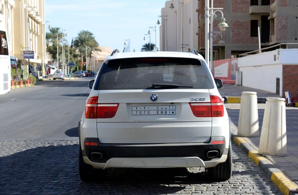 HURGHADA, EGYPT -  DECEMBER 5: The BMW X5 parked near luxury hotel on December 5, 2012 in Hurghada, Egypt. Up to 12 million tourists have visited Egypt in year 2012.