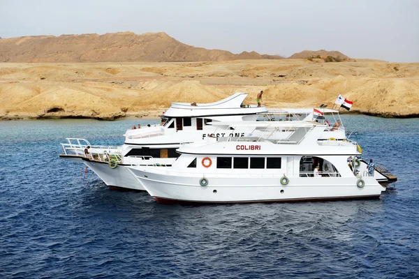 SHARM EL SHEIKH, EGYPT -  DECEMBER 4: Snorkeling tourists and motor yachts on Red Sea in Ras Muhammad National Park. It is popular tourists destination on December 4, 2013 in Sharm el Sheikh, Egypt
