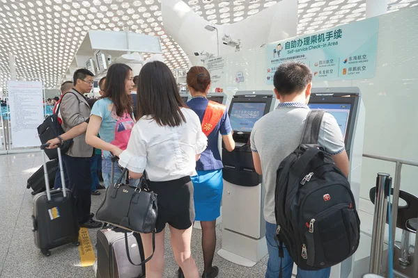 people use self check-in kiosks