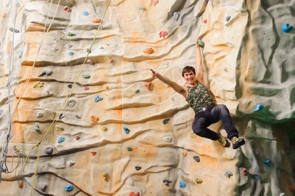 Man climbing on man-made cliff