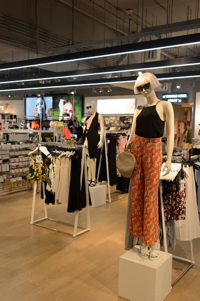 Shopping mall interior with mannequins