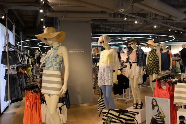 Shopping mall interior with mannequins