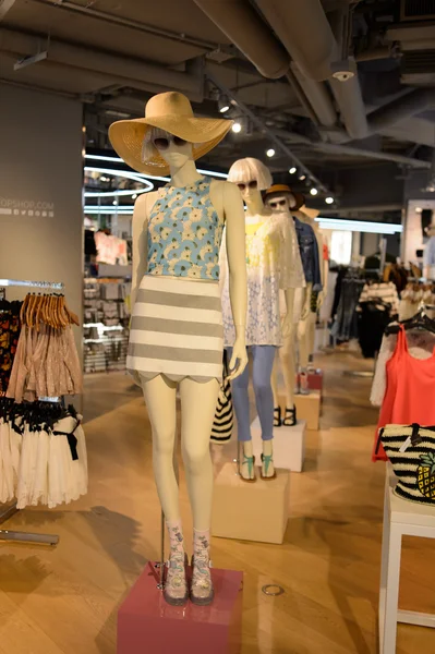 Shopping mall interior with mannequins