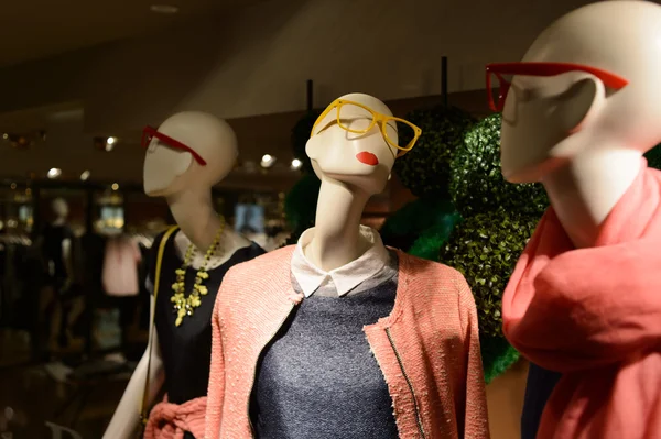 Shopping mall interior with mannequins