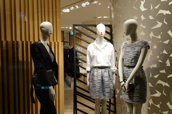 Shopping mall interior with mannequins