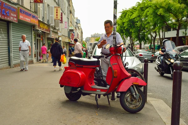 Vintage motorbike parked in the street of Paris