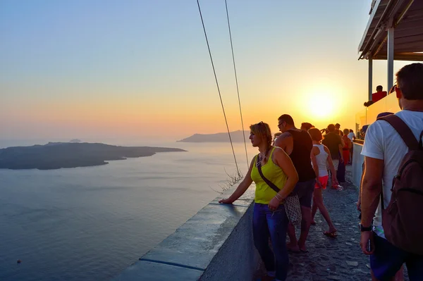 People meet sunset on Santorini island
