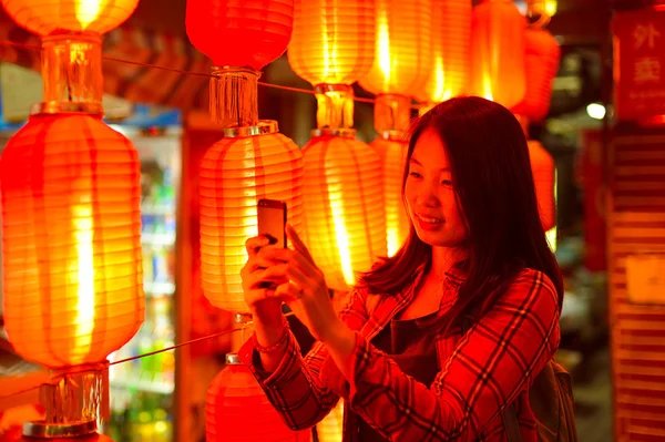 Chinese teenager with cell phone