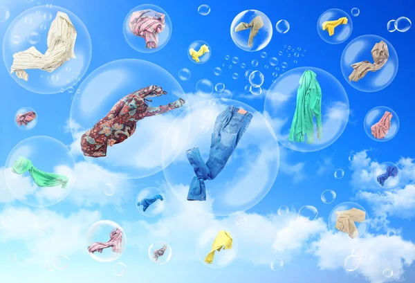 Concept of freshness. Clothes flying inside soap bubbles. Washin