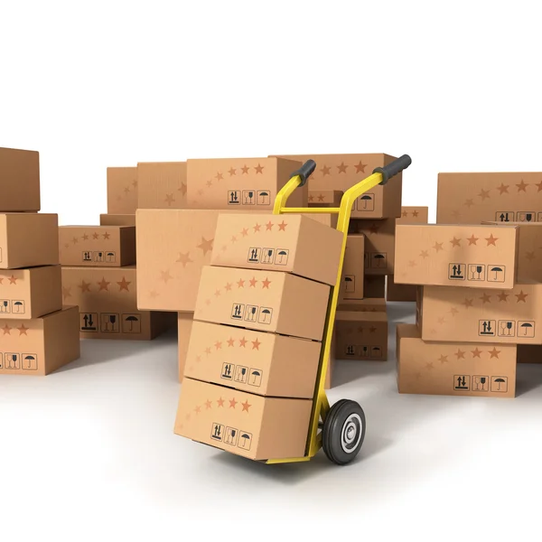 Hand truck with boxes standing on the background of boxes of dif