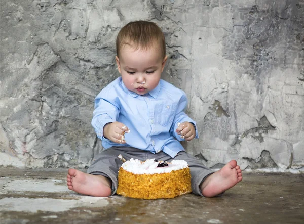 Adorable baby smashing cake