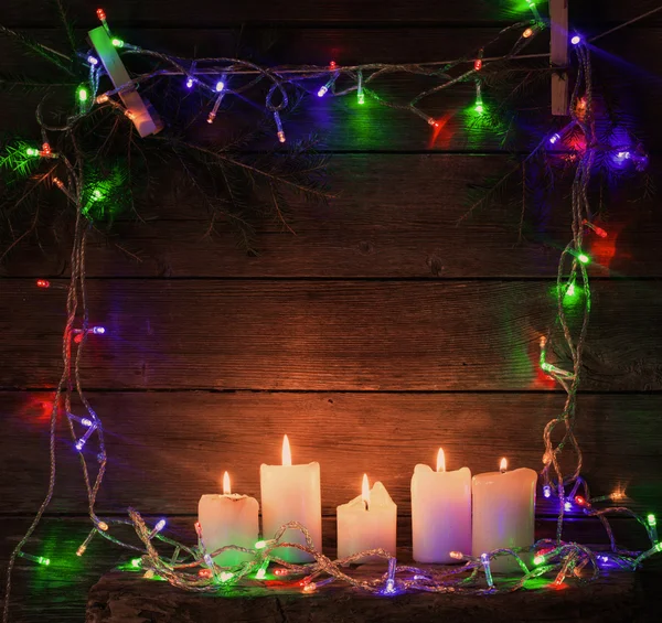 Christmas lights on a wooden background with copy space