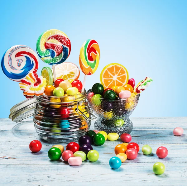 Multicolored candies in glass jar
