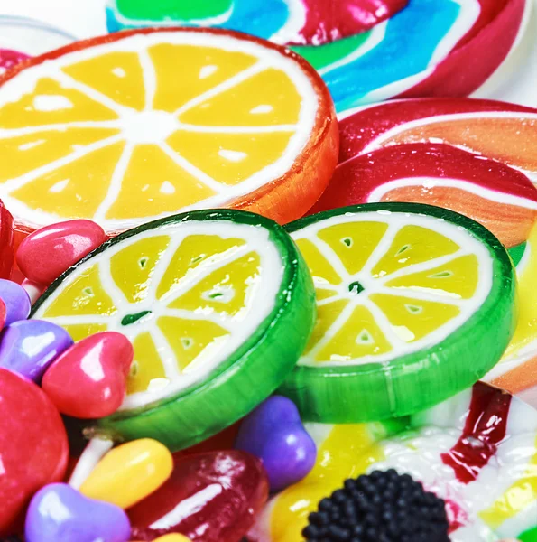Multicolored lollipops and chewing gum