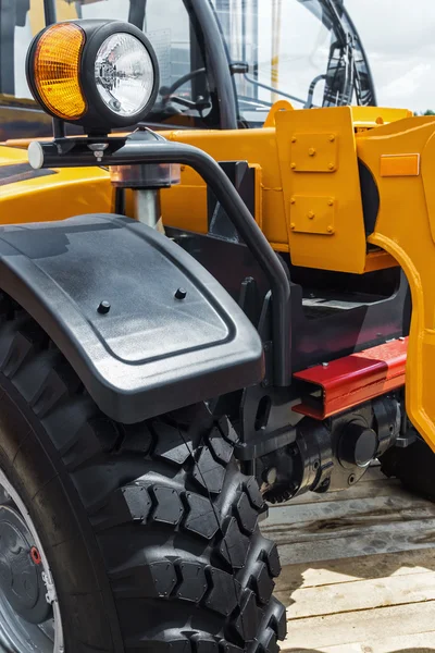 Parking lamp on yellow tractor