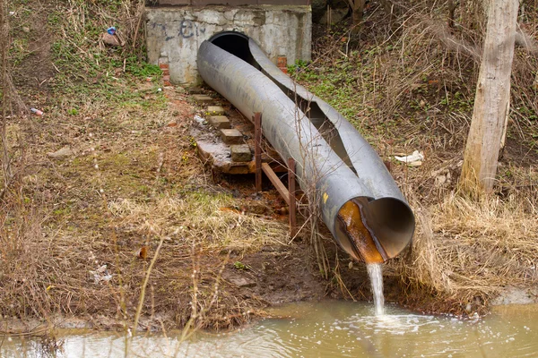 Dirty water to the river on industrial from a pipe