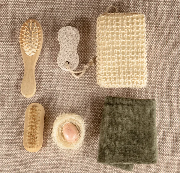 Small wooden spa set, sponge, pumice stone, a mirror, towel, brush, comb