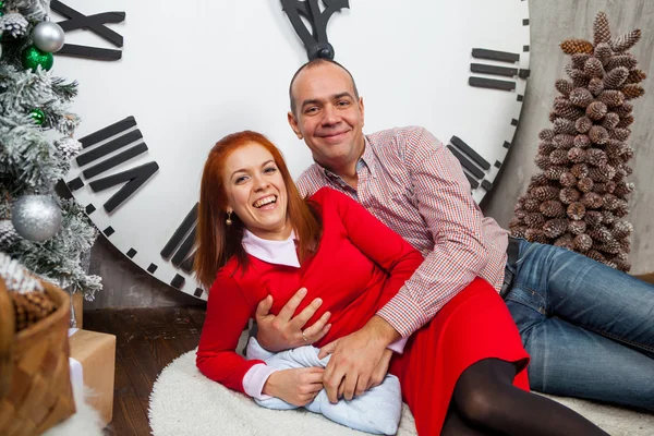 Happy man and a woman in New Year\'s Eve in a beautiful interior