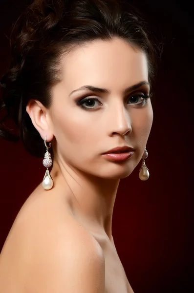 Beautiful woman in jewelry earrings