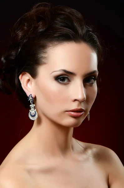 Woman in jewelry earrings