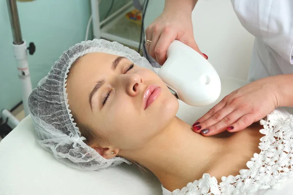 Woman having facial hair removal laser.