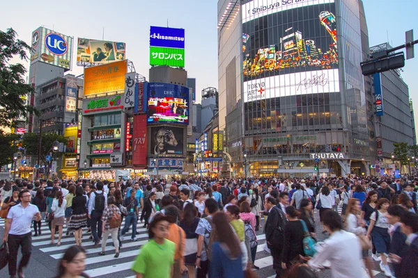 TOKYO, JAPAN - MAY 13, 2015: Pedestrians walk at Shibuya Crossin